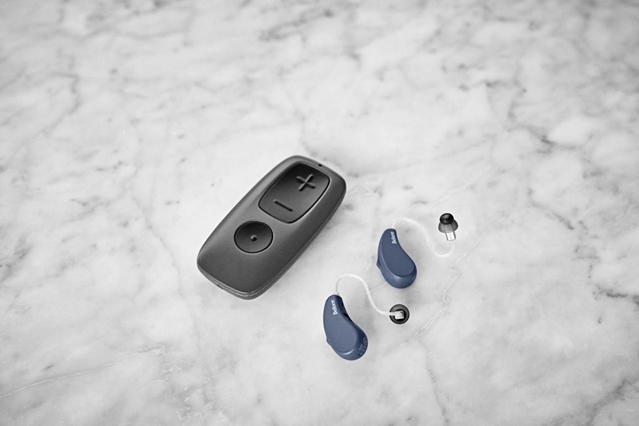 Beltone Hearing aids and remote control on table