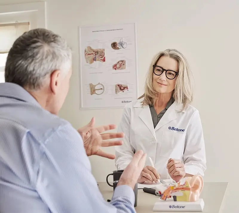 beltone audiologist discusses hearing test options with a patient